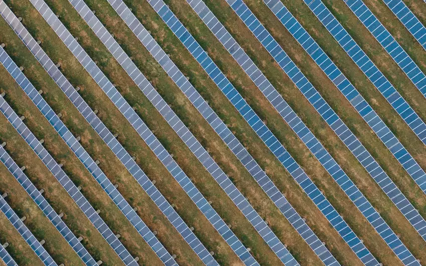 A solar farm shot from above in a field